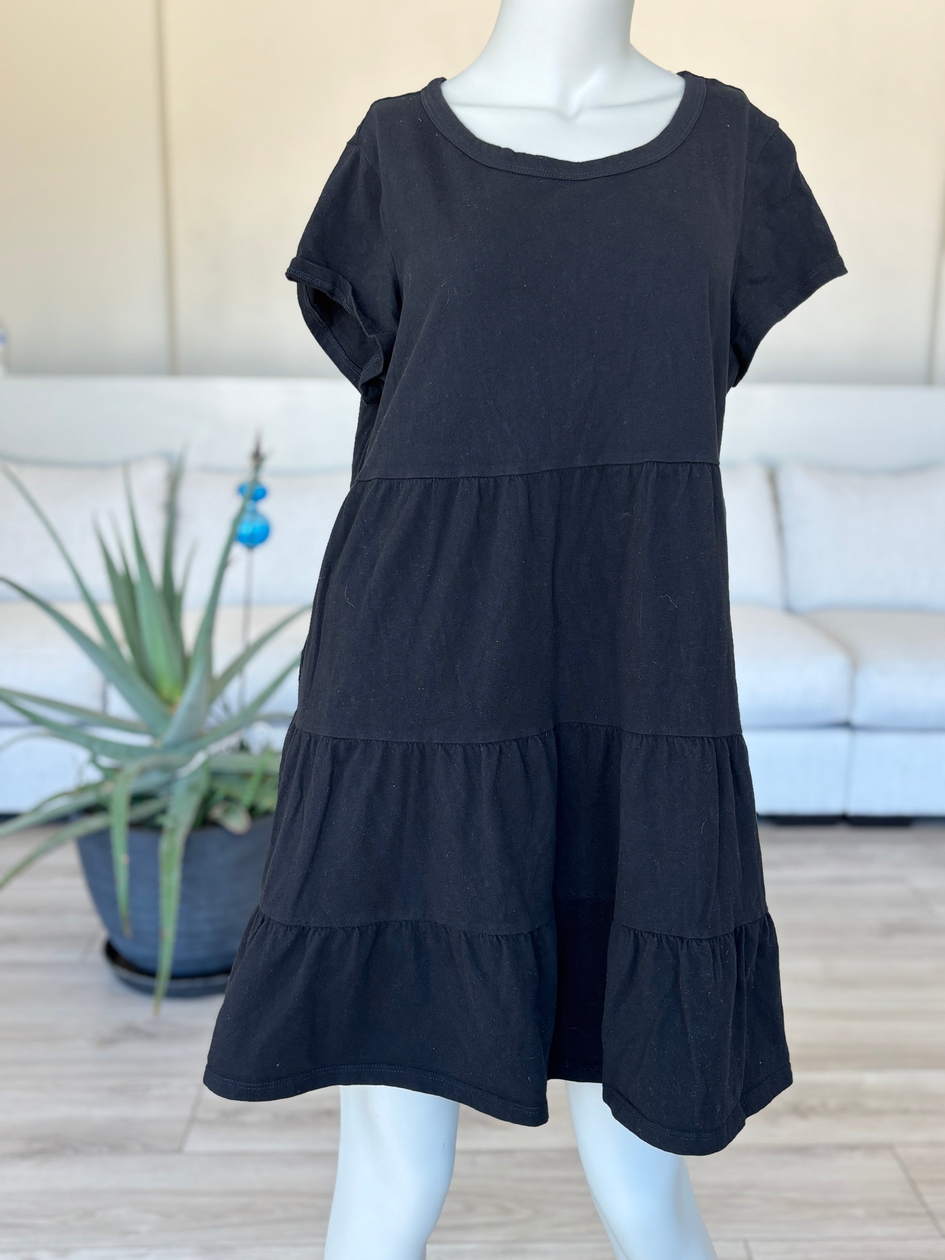 Black tiered cotton dress with short sleeves from Adored Again boutique