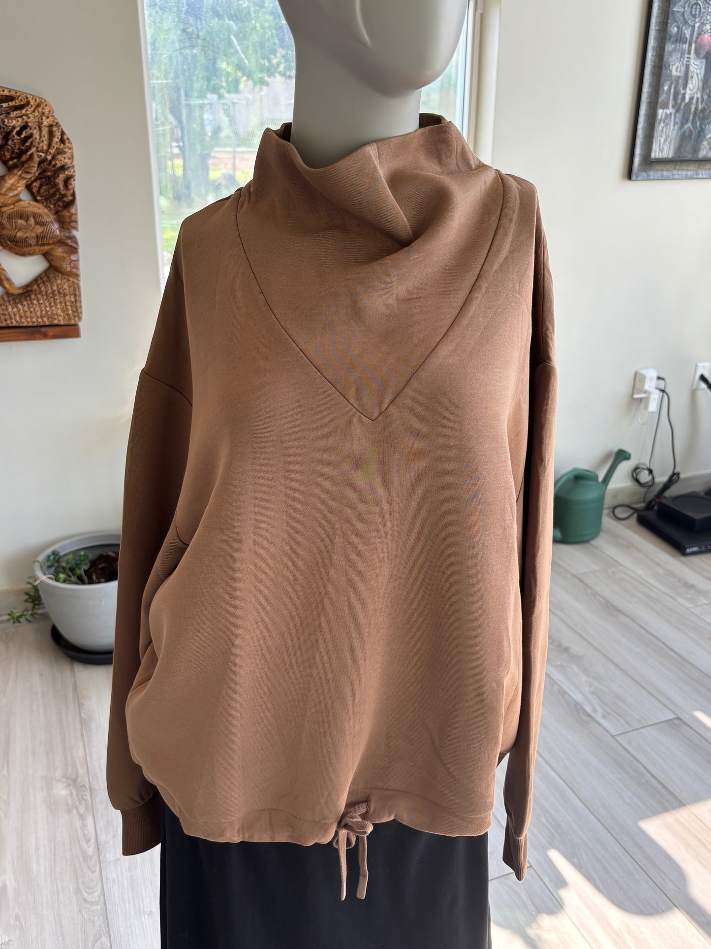 Varley oversized brown pullover crafted from smooth DoubleSoft fabric with dropped shoulders and ribbed cuffs.