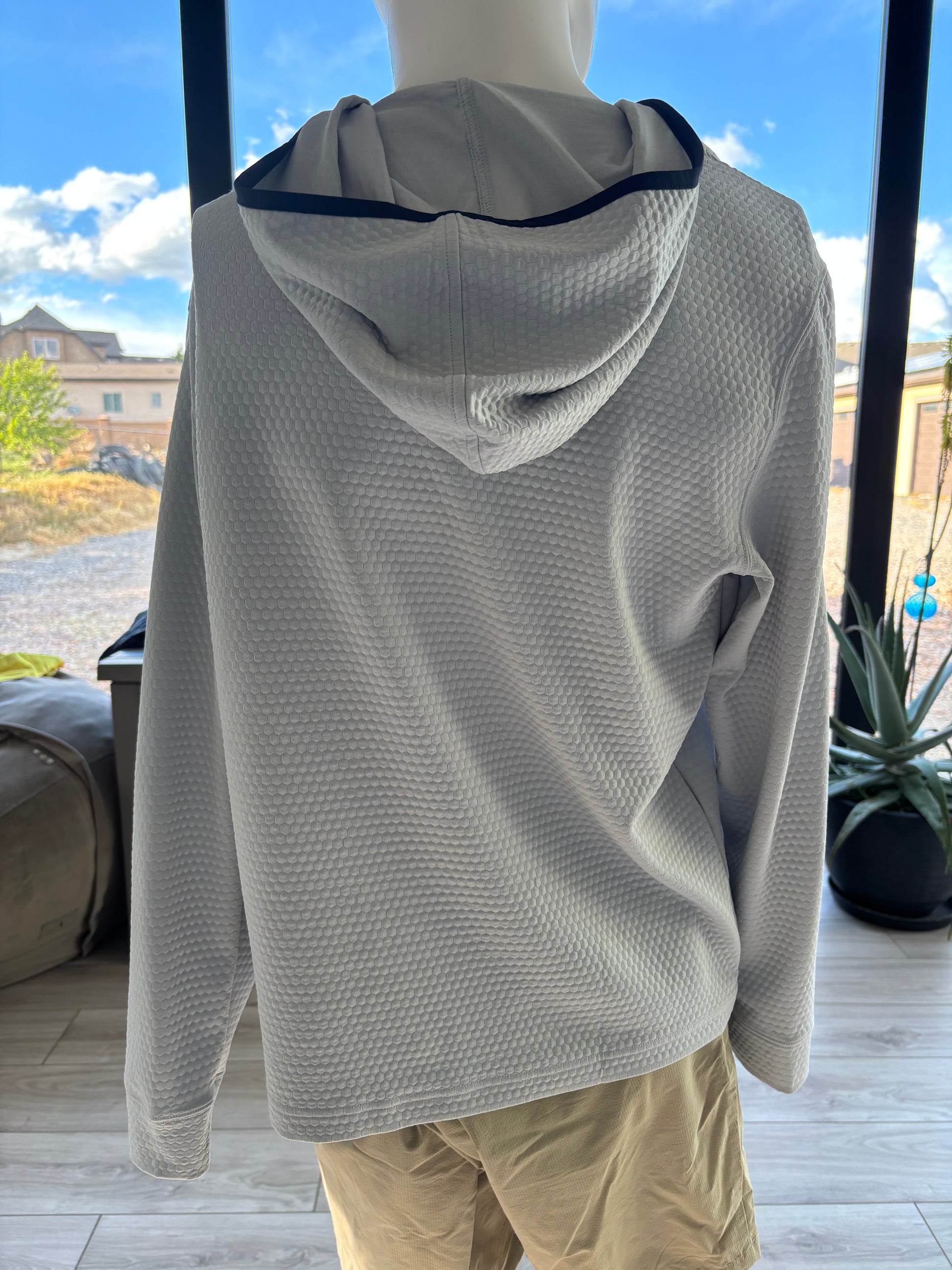Southern Tide good for boating, golf, trails.  quilted texture black trim on hoodie. caual or sports.