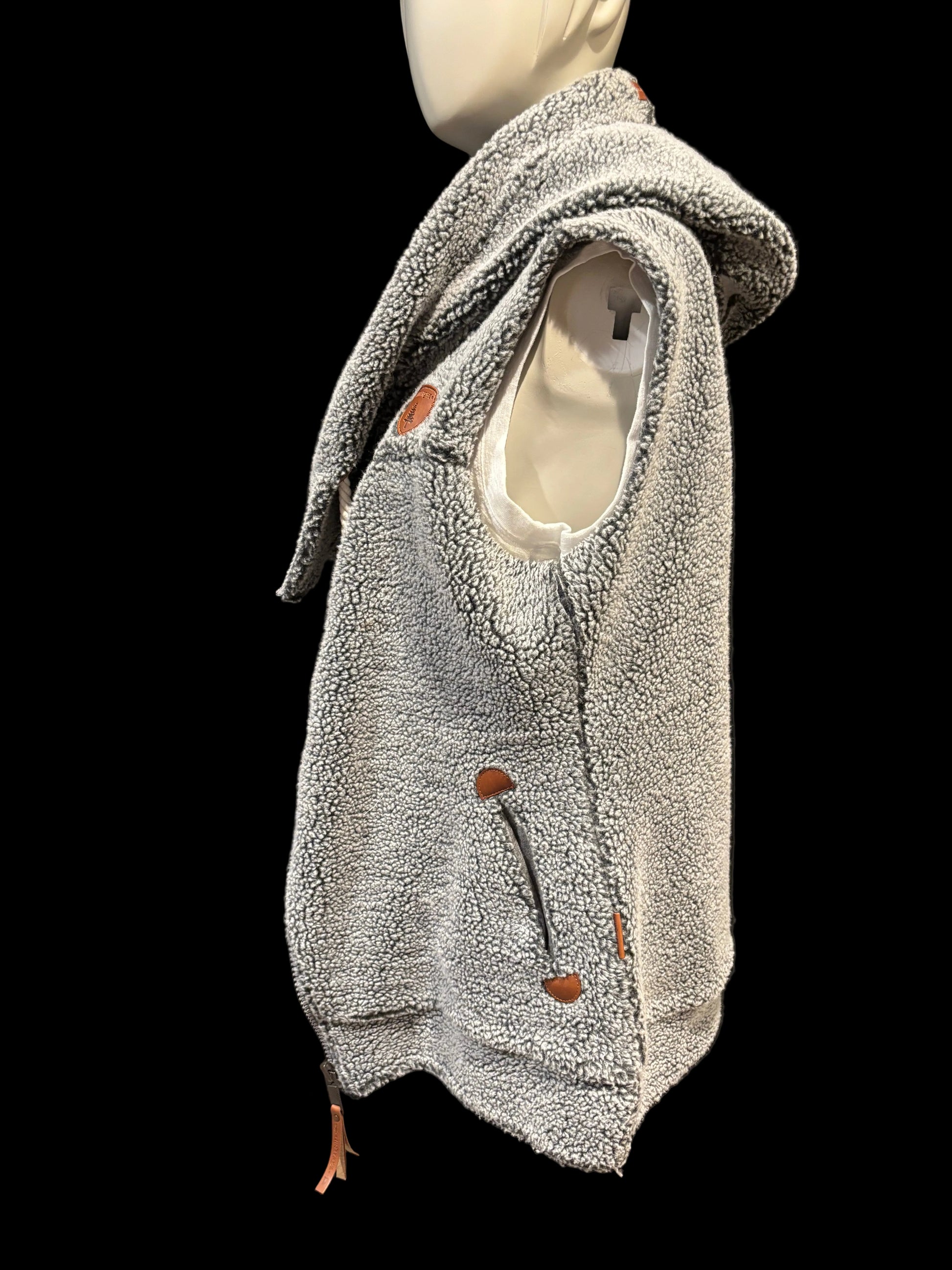Wanakome sherpa vest, leather accents side view warmth and cozyness medium/long length