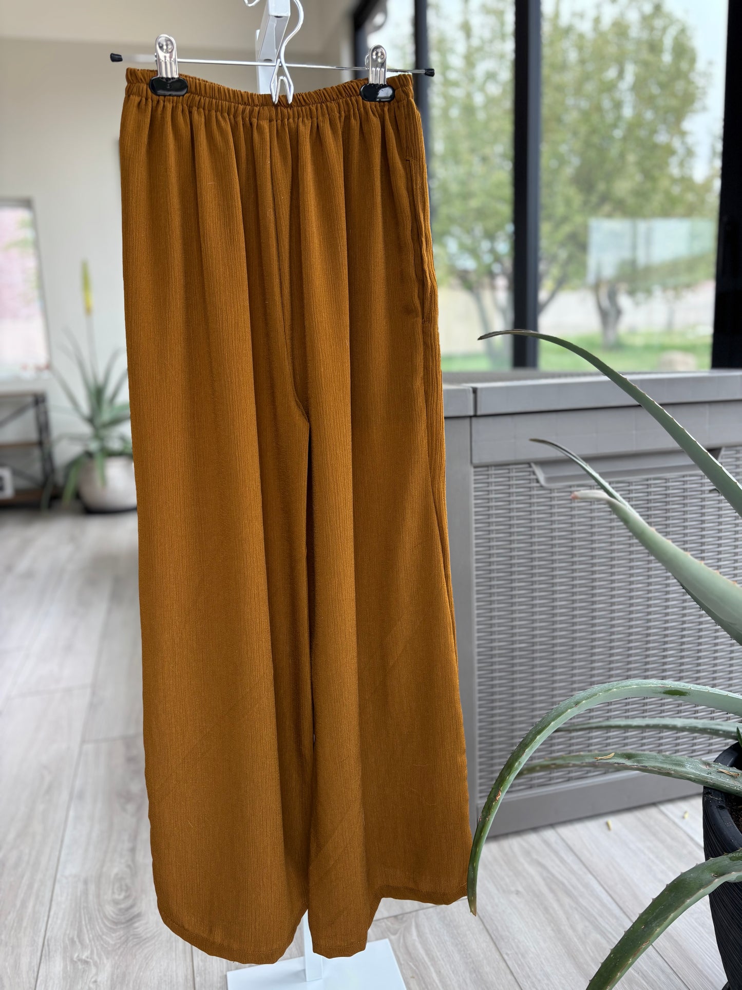 Rust color wide leg pants that flow beautifully with you wherever you go.