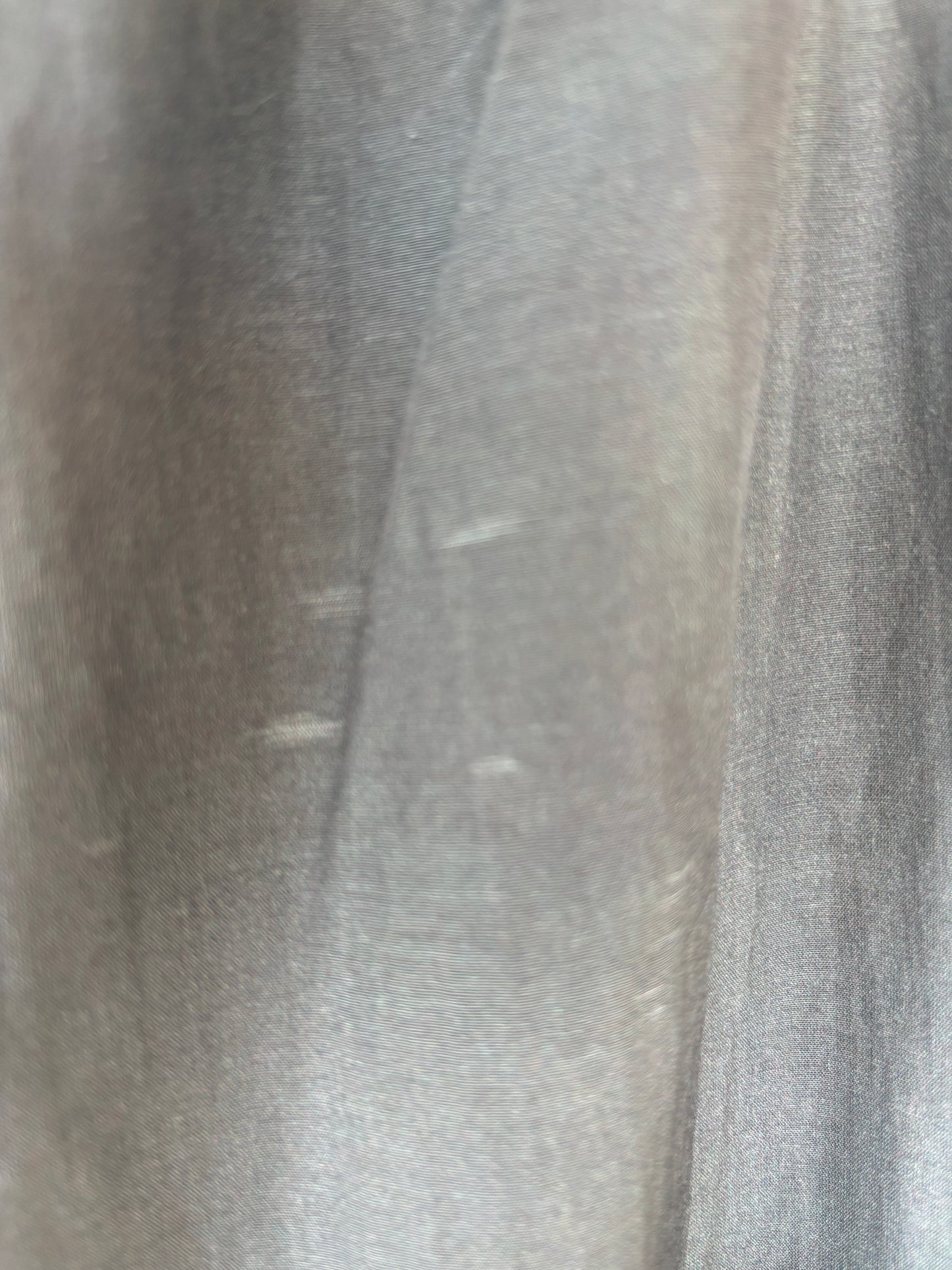 Women’s black and gray tie-dye palazzo pants with a drawstring waist, full lining, and fluid drape.