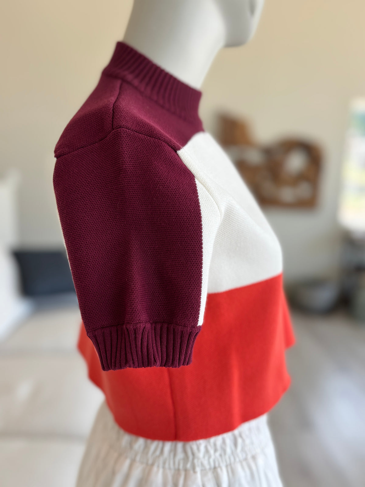 YLLW Ryder knit top with deep-burgundy shoulders, short sleeves, and ribbed sleeve cuffs