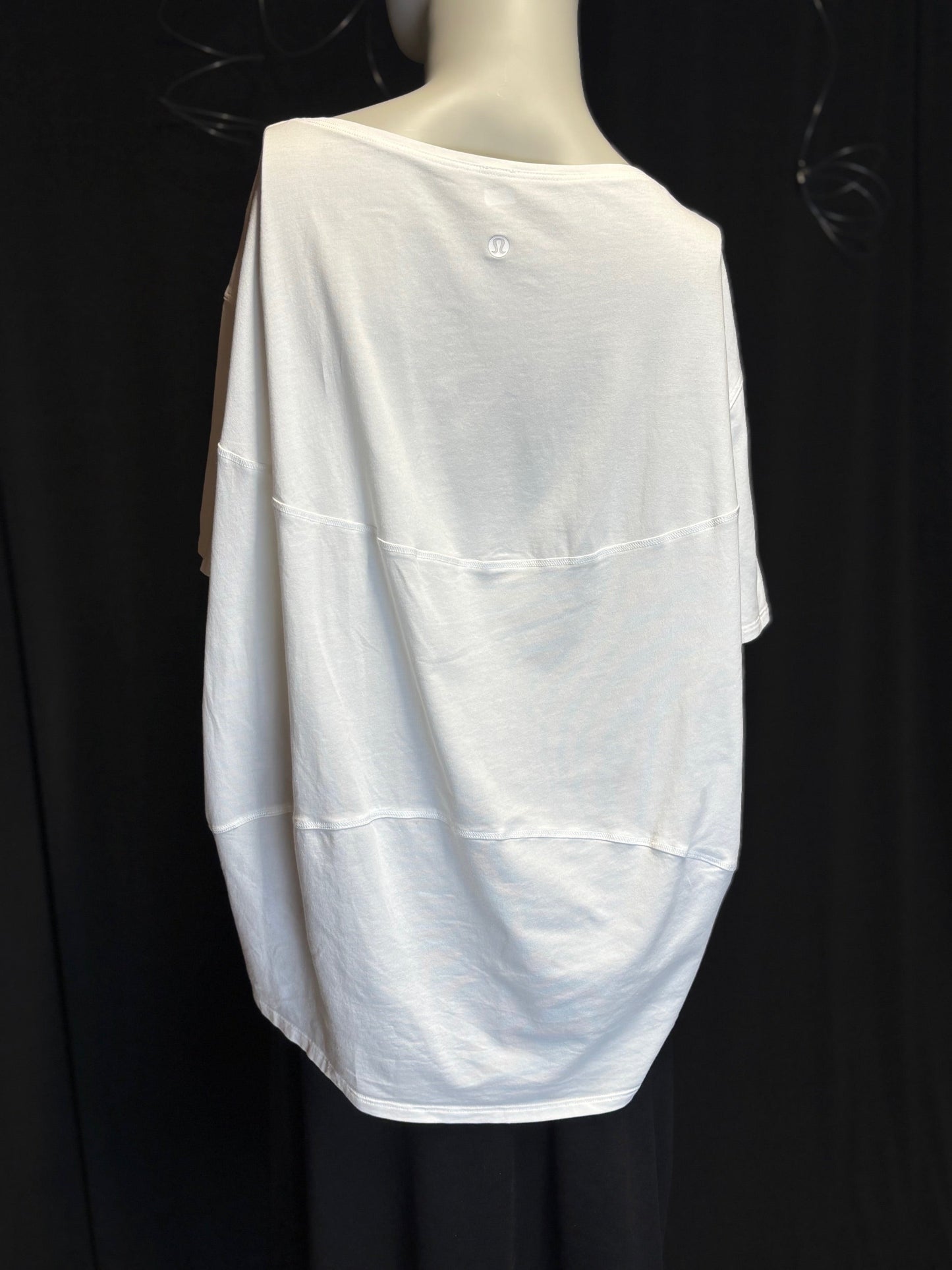 white lululemon Wildflower Flow t-shirt showing brand label and craftsmanship. Back View. Flowey