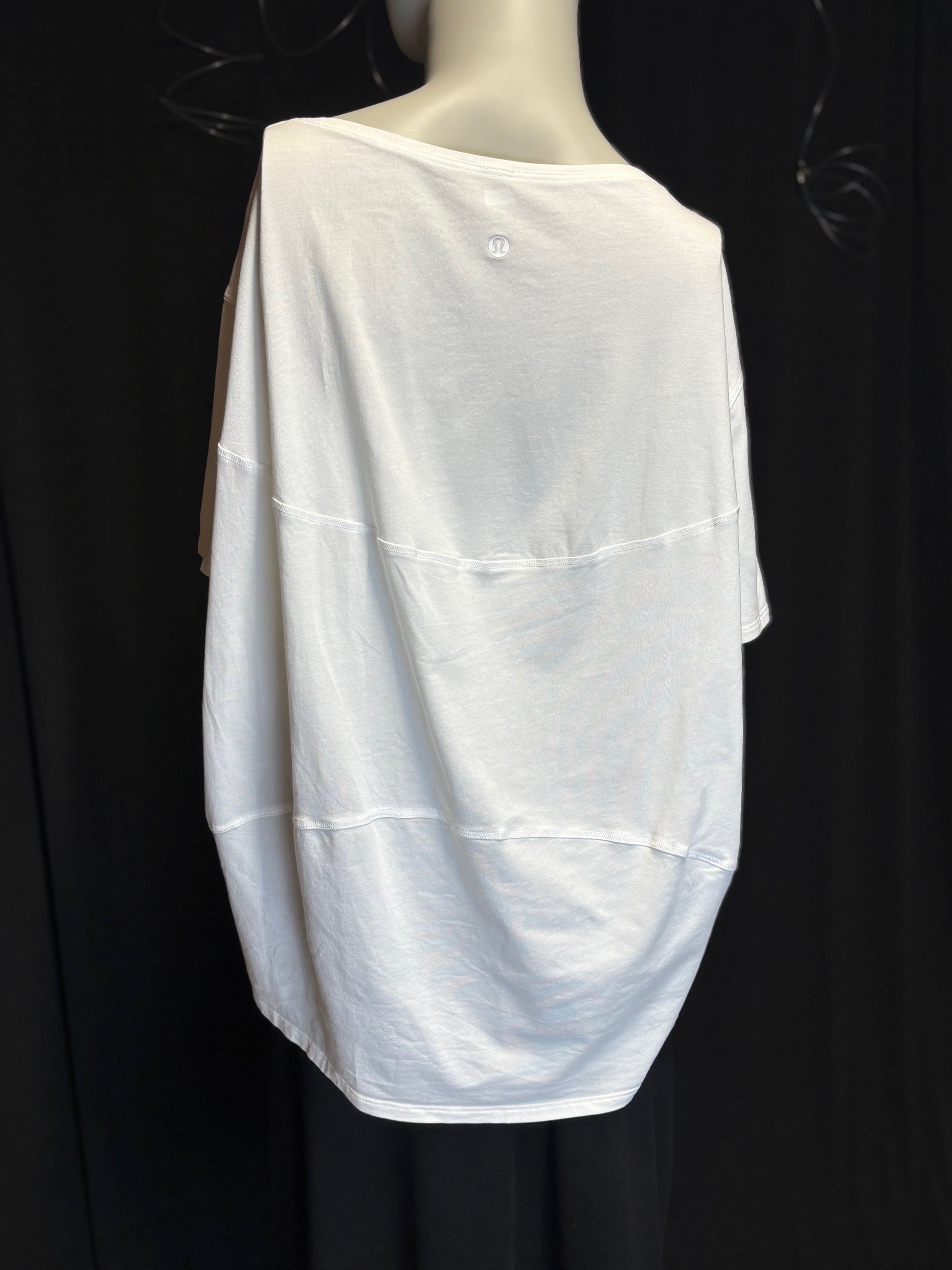 white lululemon Wildflower Flow t-shirt showing brand label and craftsmanship. Back View. Flowey