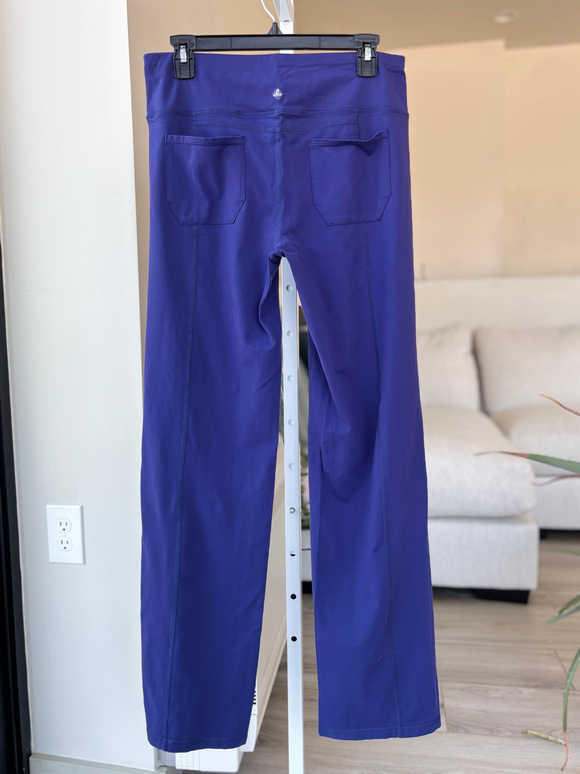 Indigo blue prAna straight-leg yoga pant with two back patch pockets, size M