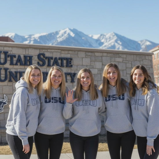 USU Students in grey  sweatshirt hoodies bonding in the same shirts.