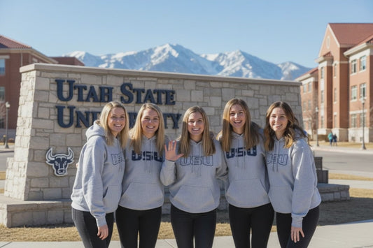 USU Students in grey  sweatshirt hoodies bonding in the same shirts.