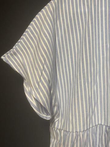 Close-up detail of Striped Mist dress sleeve showing vertical stripe pattern and fabric quality